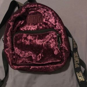 pink victoria secret mini backpack that is velvet
